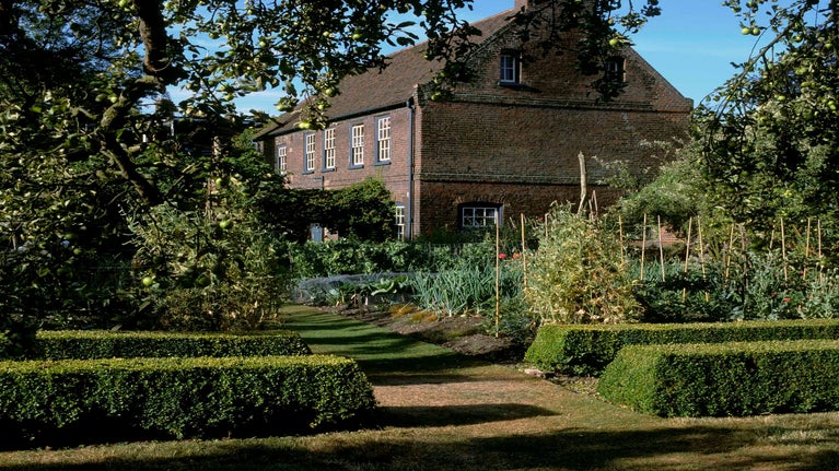 A view across the kitchen garden to the former coach house